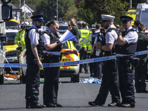 Police clash with a violent crowd gathered near the site of UK stabbing attack that killed 3 girls