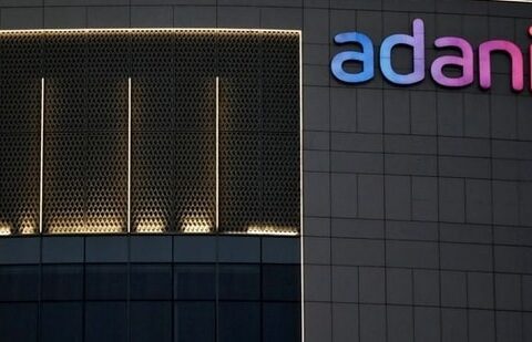 The logo of the Adani Group is seen on the facade of one of its buildings on the outskirts of Ahmedabad.(Reuters)