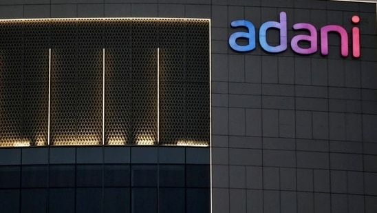 The logo of the Adani Group is seen on the facade of one of its buildings on the outskirts of Ahmedabad.(Reuters)