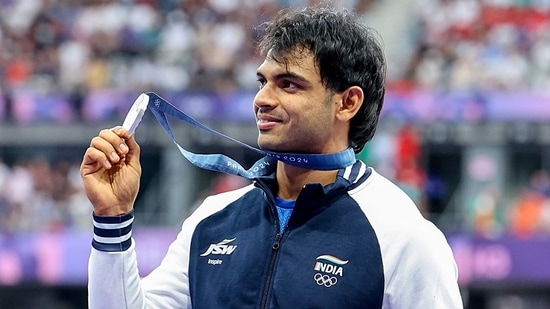 India's Javelin thrower Neeraj Chopra poses for a picture with his silver medal