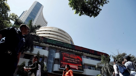 People walk past the Bombay Stock Exchange (BSE) building in Mumbai, India. (Francis Mascarenhas/Reuters)