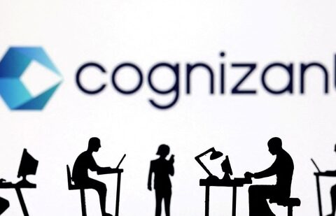 Figurines with computers and smartphones are seen in front of Cognizant's logo.(Reuters)