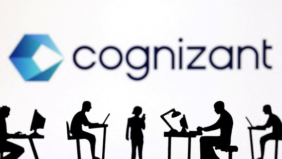 Figurines with computers and smartphones are seen in front of Cognizant's logo.(Reuters)