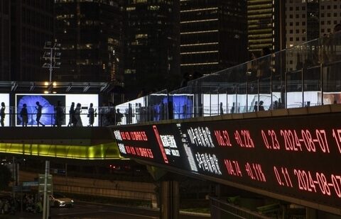 An electronic ticker displays stock figures in Shanghai, China.(Bloomberg)