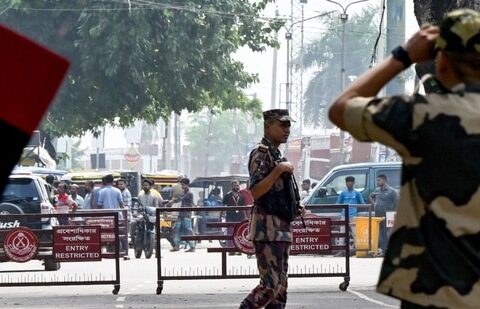 Border Security Force (BSF) personnel stand guard at the India-Bangladesh border of Petrapole about 100km north east of Kolkata.(AFP)