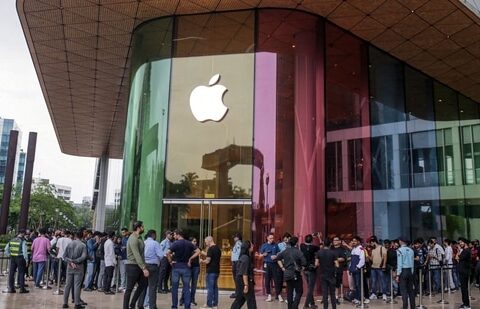 Customers queue outside an Apple Inc. store ahead of its opening hours during the first day of sale of the iPhone 15 smartphone in Mumbai. (Bloomberg)