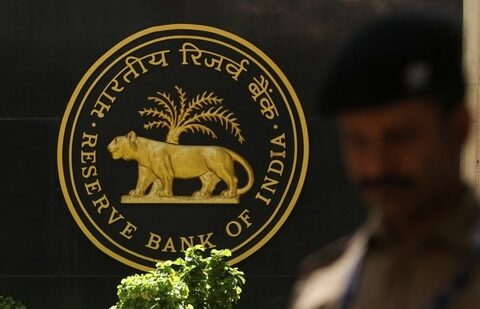 RBI MPC: A police officer walks past the Reserve Bank of India (RBI) logo inside its headquarters in Mumbai, India.(Reuters)