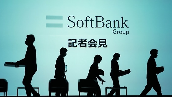 Workers on the stage as they prepare for a SoftBank Group Corp. news conference in Tokyo, Japan.(Bloomberg)