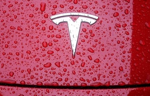 A Tesla logo is pictured on a car in the rain in the Manhattan borough of New York City.(Reuters)