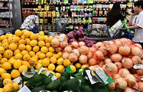 People shop at a grocery store in Rosemead, California. US consumer inflation eased slightly in July, according to US Labor Department data.(AFP)