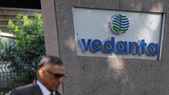 A man walks past the logo of Vedanta outside its headquarters in Mumbai.(Reuters)