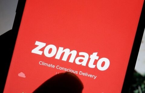 Zomato Q1 results: The logo of Indian food delivery company Zomato is seen on its app on a mobile phone displayed in front of its company website.(REUTERS)