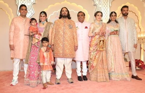 Mukesh Ambani, Akash Ambani, Shloka Ambani, Anand Piramal and Isha Ambani decked up in pastel outfits.