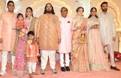 Mukesh Ambani, Akash Ambani, Shloka Ambani, Anand Piramal and Isha Ambani decked up in pastel outfits.