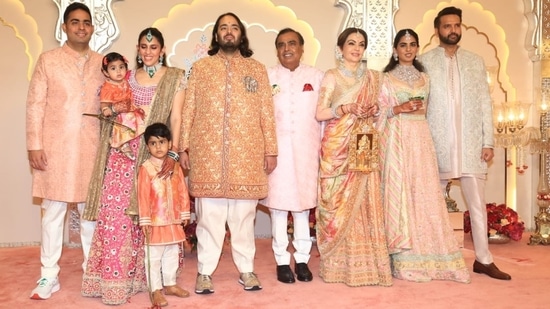 Mukesh Ambani, Akash Ambani, Shloka Ambani, Anand Piramal and Isha Ambani decked up in pastel outfits.