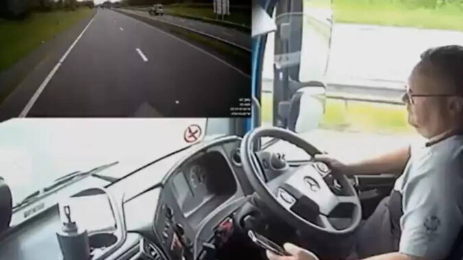 Driver crashes lorry while looking for podcast on his phone, narrowly avoids family - Video