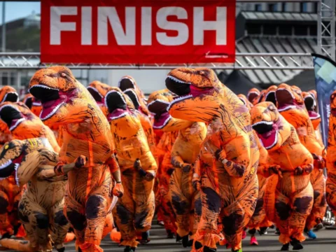 T-Rex Charity Run: More than 500 UK runners set unofficial record with giant T-rex charity run