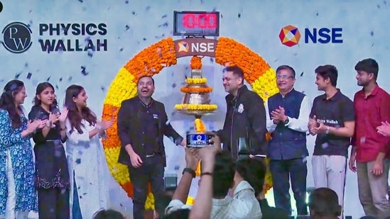 PhysicsWallah share price soars nearly 50% on debut for over $5-billion valuation| Business News Physics Wallah co-founder Alakh Pandey and Prateek Maheshwari at the listing ceremony of their company at the National Stock Exchange in Mumbai on Tuesday (18 November 2025). (NSE)