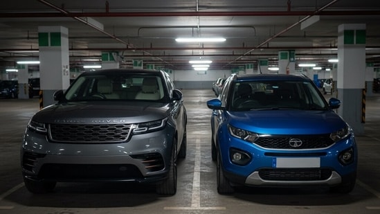 A Range Rover and Tata Nexon in an underground parking lot. (AI Image)