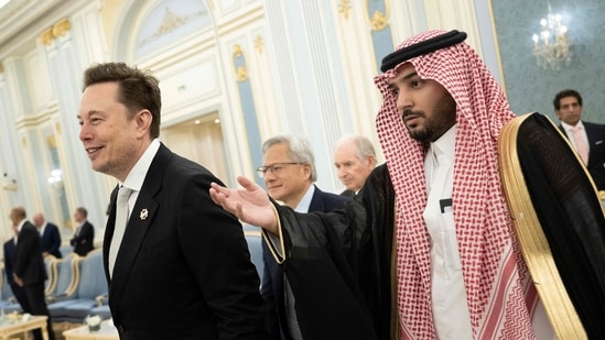 Elon Musk (left) and Nvidia CEO Jensen Huang (centre) are directed to greet the Saudi Crown Prince at the Royal Court in Riyadh on 13 May 2025. (File Photo/AFP)
