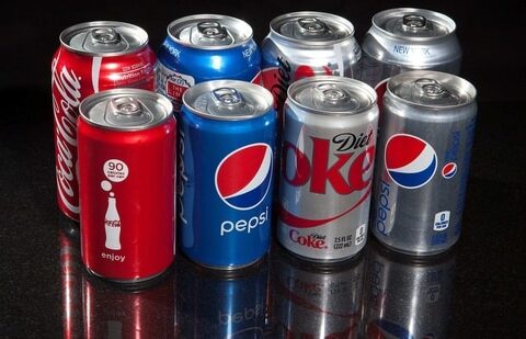 Regular and mini cans of Coke and Pepsi are pictured in this photo illustration in New York. (File Photo / REUTERS)