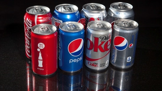 Regular and mini cans of Coke and Pepsi are pictured in this photo illustration in New York. (File Photo / REUTERS)