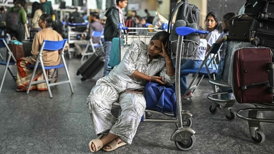 View | First Air India, now IndiGo — India’s aviation crisis is all about ‘too big to tame’ A passenger waits outside the IndiGo Airlines kiosk at the Kempegowda International Airport in Bengaluru amid cancellations by India's largest airline. (AFP)