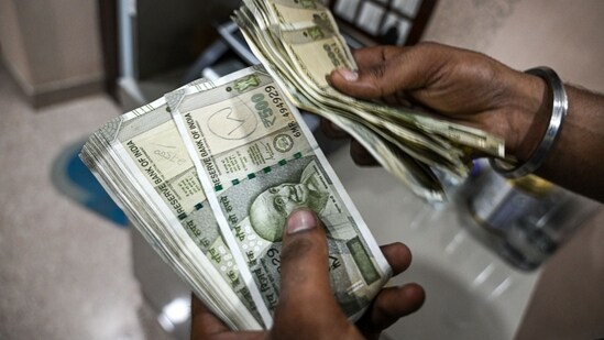 Rupee weakens to record low against US dollar| Business News The rupee declined to 89.59 against the U.S. dollar, dipping past its previous record low of 89.49 hit about two weeks ago. (Bloomberg)