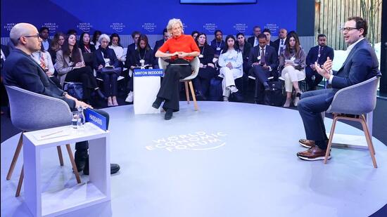 CEO of DeepMind Technologies Demis Hassabis and CEO and co-founder of Anthropic Dario Amodei talk during the 56th annual World Economic Forum meeting in Davos, Switzerland, on January 20. (Reuters)
