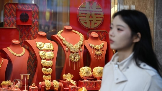 In a first, gold price breaches past $5,000 amid Trump-fuelled global tensions| Business News The price of safe-haven asset gold surpassed 5,000 USD, hitting a record amid rising global uncertainty. (AFP)