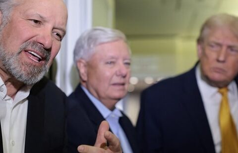 US Commerce Secretary Howard Lutnick (left) and Senator Lindsey Graham (centre) and President Donald Trump speak to reporters aboard Air Force One on 4 January 2026. (Reuters)