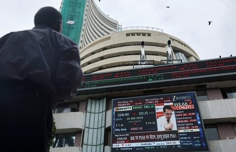 A man looks at a screen outside the Bombay Stock Exchange (BSE) in Mumbai. (REUTERS)