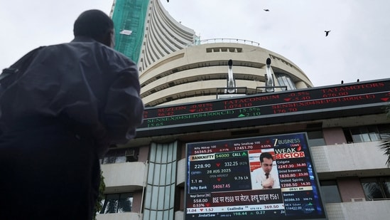 A man looks at a screen outside the Bombay Stock Exchange (BSE) in Mumbai. (REUTERS)