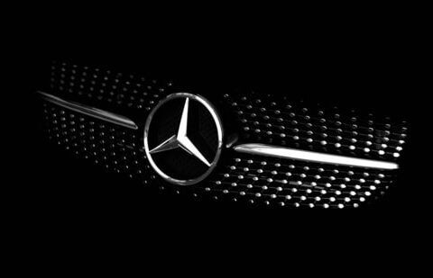 The Mercedes-Benz logo is pictured on the hood of a car. (Unsplash)
