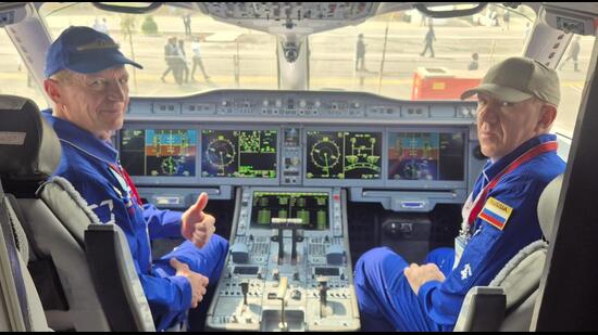 Russian pilots inside the SJ-100 cockpit at Wings India 2026 in Hyderabad