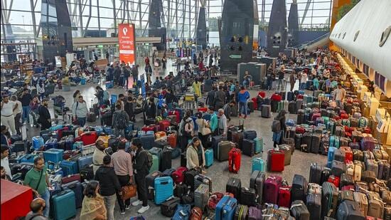 IndiGo hit with record ₹22 crore fine for Dec chaos| Business News Stranded passengers search for their luggage after IndiGo cancelled several flights, at the Kempegowda International Airport, in Bengaluru on Dec. 5, 2025. (PTI)