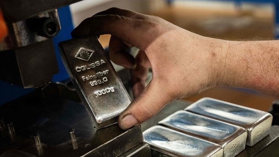 Silver down 16%, gold drops 3.5% as volatility grips precious metals| Business News Silver is struggling to find a price floor following a historic market rout. (AFP)