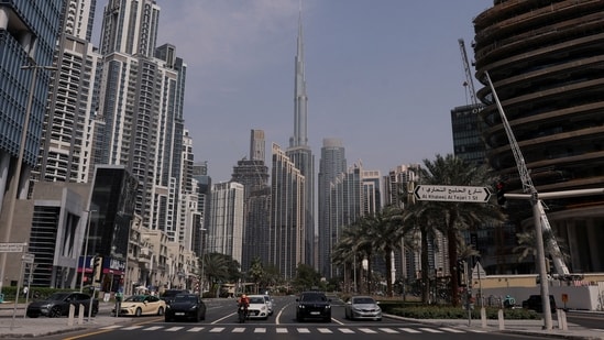 Vehicle wait at a traffic signal with Burj Khalifa in the background, after an Iranian attack, following United States and Israel strikes on Iran, in Dubai, United Arab Emirates, on 1 March 2026. (Reuters)