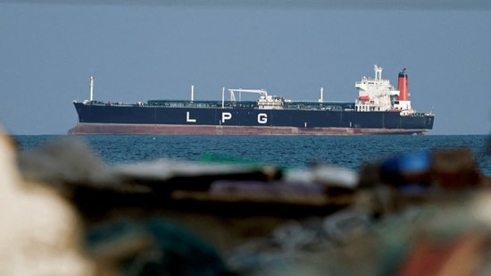 An LPG gas tanker at anchor as traffic is down in the Strait of Hormuz, amid the Iran war, in Shinas, Oman, on 11 March 2026. The Iran war, and the consequent blockade of the Strait of Hormuz, threatens to close the “goldilocks” trade window for India's economy. (Reuters)