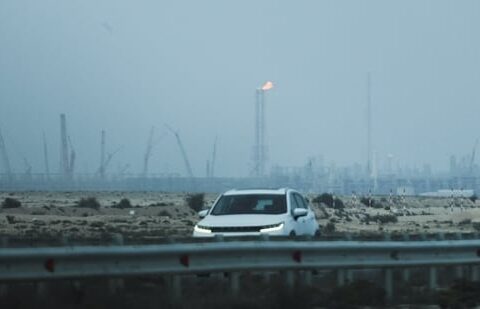 A car passes near QatarEnergy's LNG production facilities, amid the Iran war, in Ras Laffan Industrial City of Qatar on Monday, 2 March 2026. (Reuters)