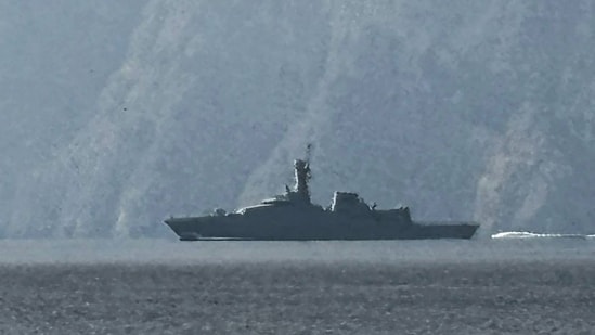 Three crude oil tankers attacked in Strait of Hormuz as Iran war spreads| Business News A navy vessel is seen sailing in the Strait of Hormuz on Sunday, 1 March 2026. (AFP)