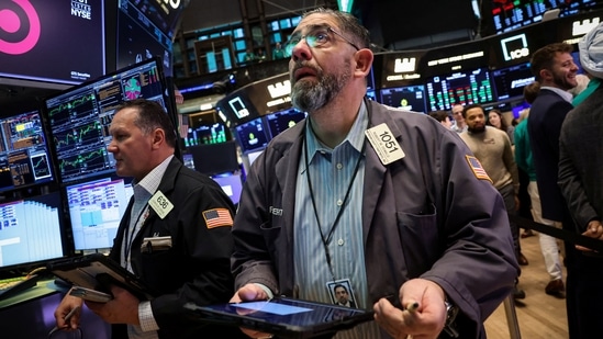 Traders work on the floor at the New York Stock Exchange in New York City on Tuesday, 3 March 2026. Markets are repricing for the risk of a more extended Iran war. (Reuters)