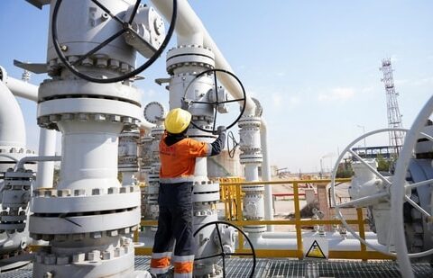 Brent crude oil prices spike toward $120/barrel Iran War forces more production cuts| Business News A worker operates valves at the Rumaila oil field in Basra, Iraq, to cut nearly 1.5 million barrels per day of output as exports halted due to the effective closure of the Strait of Hormuz amid the Iran war. (Reuters)
