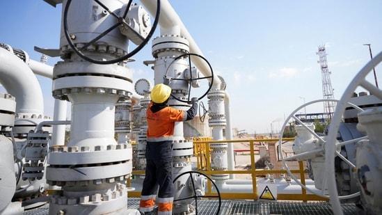 A worker operates valves at the Rumaila oil field in Basra, Iraq, to cut nearly 1.5 million barrels per day of output as exports halted due to the effective closure of the Strait of Hormuz amid the Iran war. (Reuters)