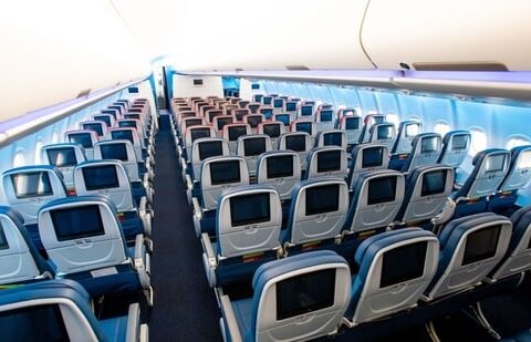 The Economy Cabin on Airplanes Keeps on Shrinking| Business News Looking down the aisle at the main cabin and Comfort Plus sections of Delta's Airbus A330neo plane.