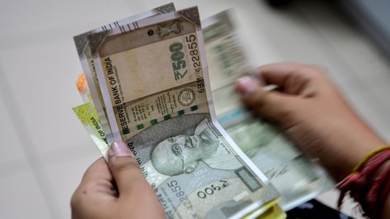 Traders reckon that the Reserve Bank of India will likely step in to avert a sharp slide in the rupee against the US dollar. (PTI)