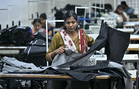 A woman working at a textile unit in India. EY sees India's textile industry as among the most impacted by the ongoing Iran war. (HT)