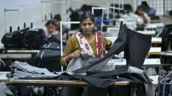 Iran war can cut India GDP growth rate by 100 bps in FY27, EY says| Business News A woman working at a textile unit in India. EY sees India's textile industry as among the most impacted by the ongoing Iran war. (HT)