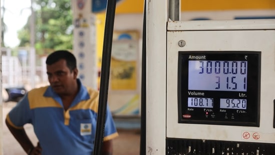 Newly increased fuel prices are displayed at a petrol pump in Malvan. (REUTERS)