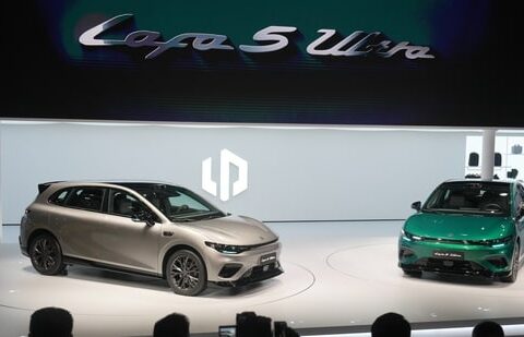 Attendees look at the Leapmotor new Lafa 5 Ultra models on stage after being unveiled by Leapmotor President Cao Li at the Auto China 2026, in Beijing, Friday, April 24, 2026. (AP)